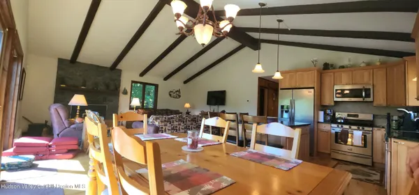 a living room with lots of furniture and a chandelier