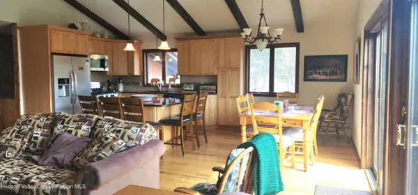 a view of a dining room with furniture window and outside view