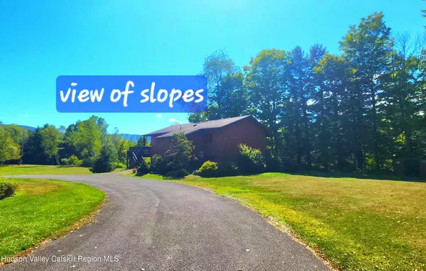 a view of a street with a building in the background