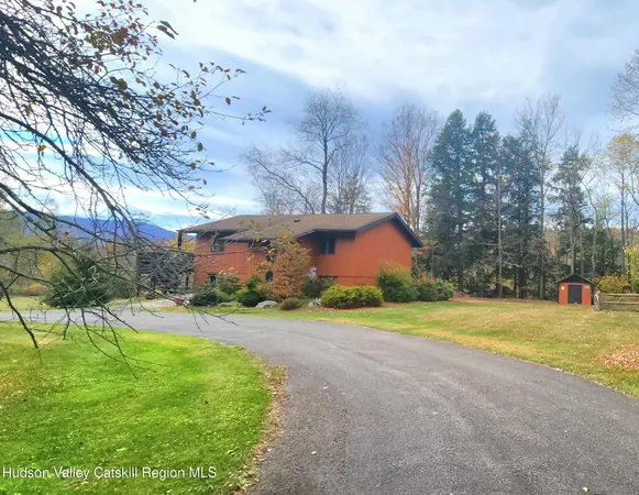 a view of a swimming pool and a yard