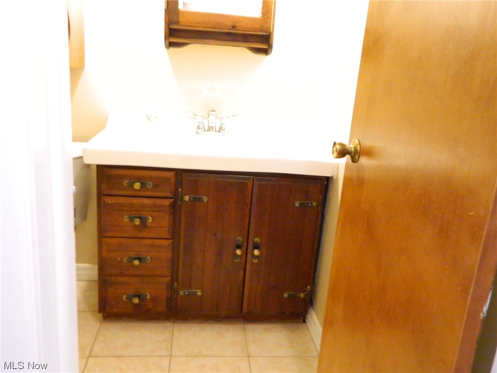 10744 Valley View Road, Unit B8 Northfield, OH 44067 - Photo 14 of 15 Additional bathroom view for ceramic floor and spaciousness of the vanity/cabinet