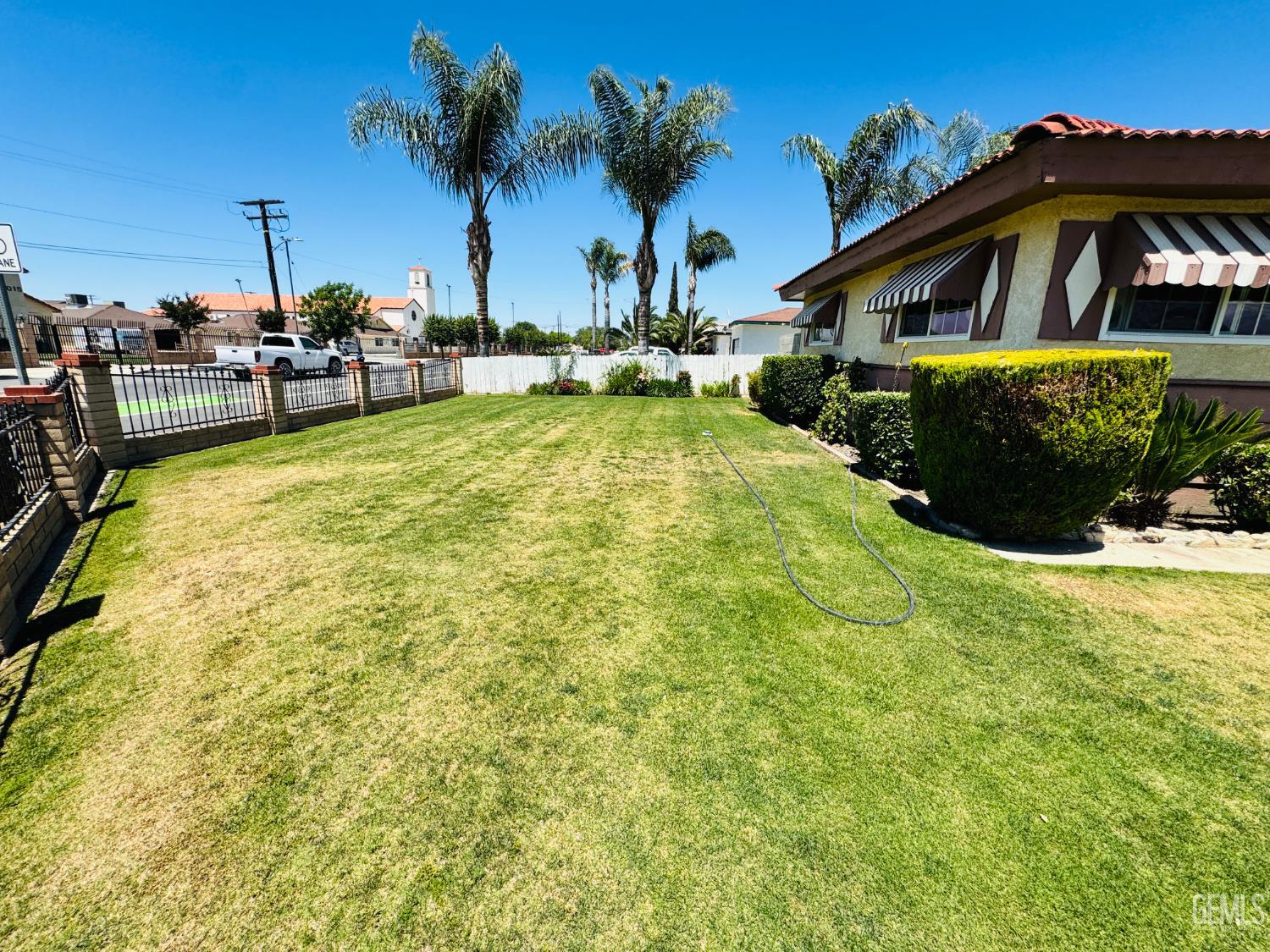Undisclosed Address Delano, CA 93215 - Photo 14 of 14 a view of a house with pool and chairs