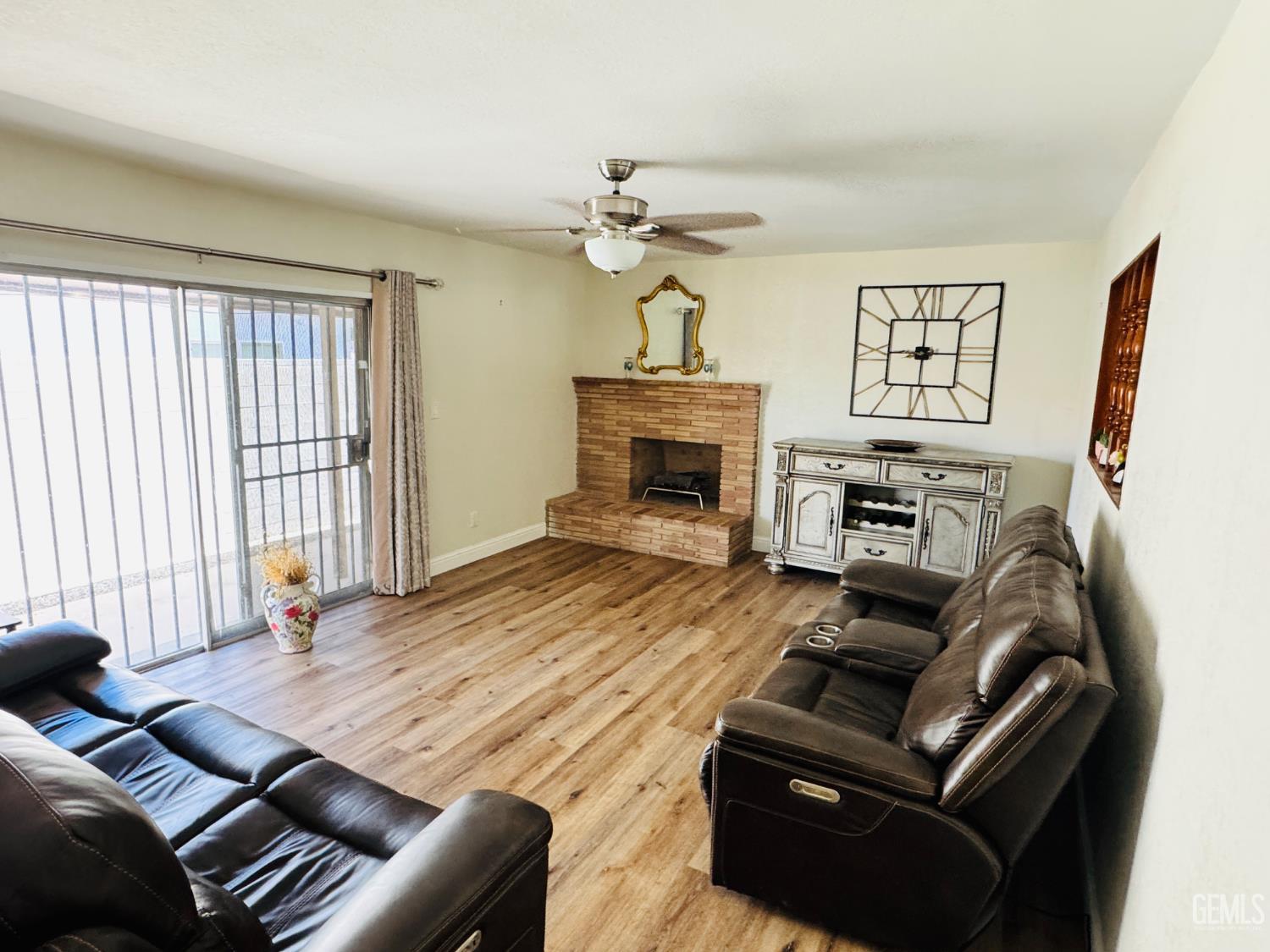 Undisclosed Address Delano, CA 93215 - Photo 3 of 14 a living room with furniture fireplace and a window