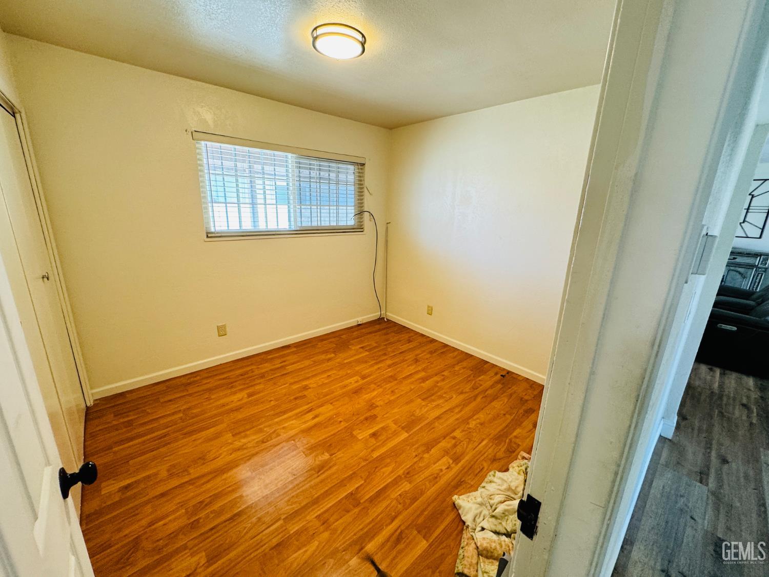 Undisclosed Address Delano, CA 93215 - Photo 5 of 14 an empty room with windows