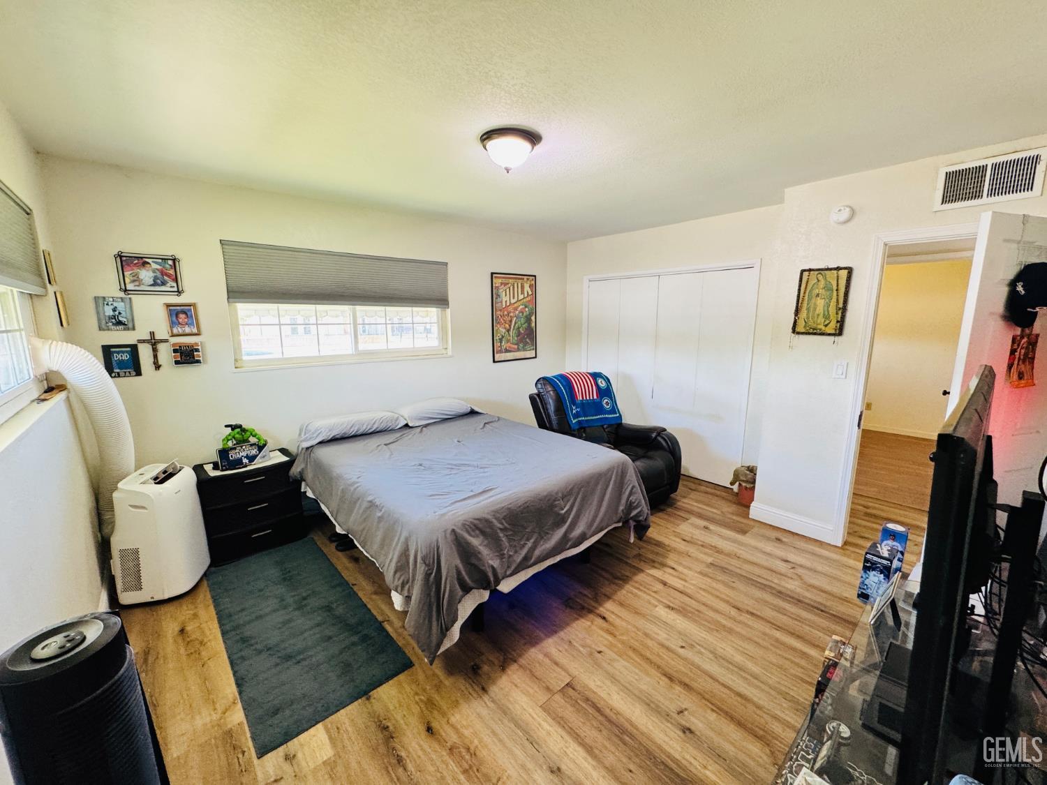 Undisclosed Address Delano, CA 93215 - Photo 6 of 14 a bedroom with a bed and a window