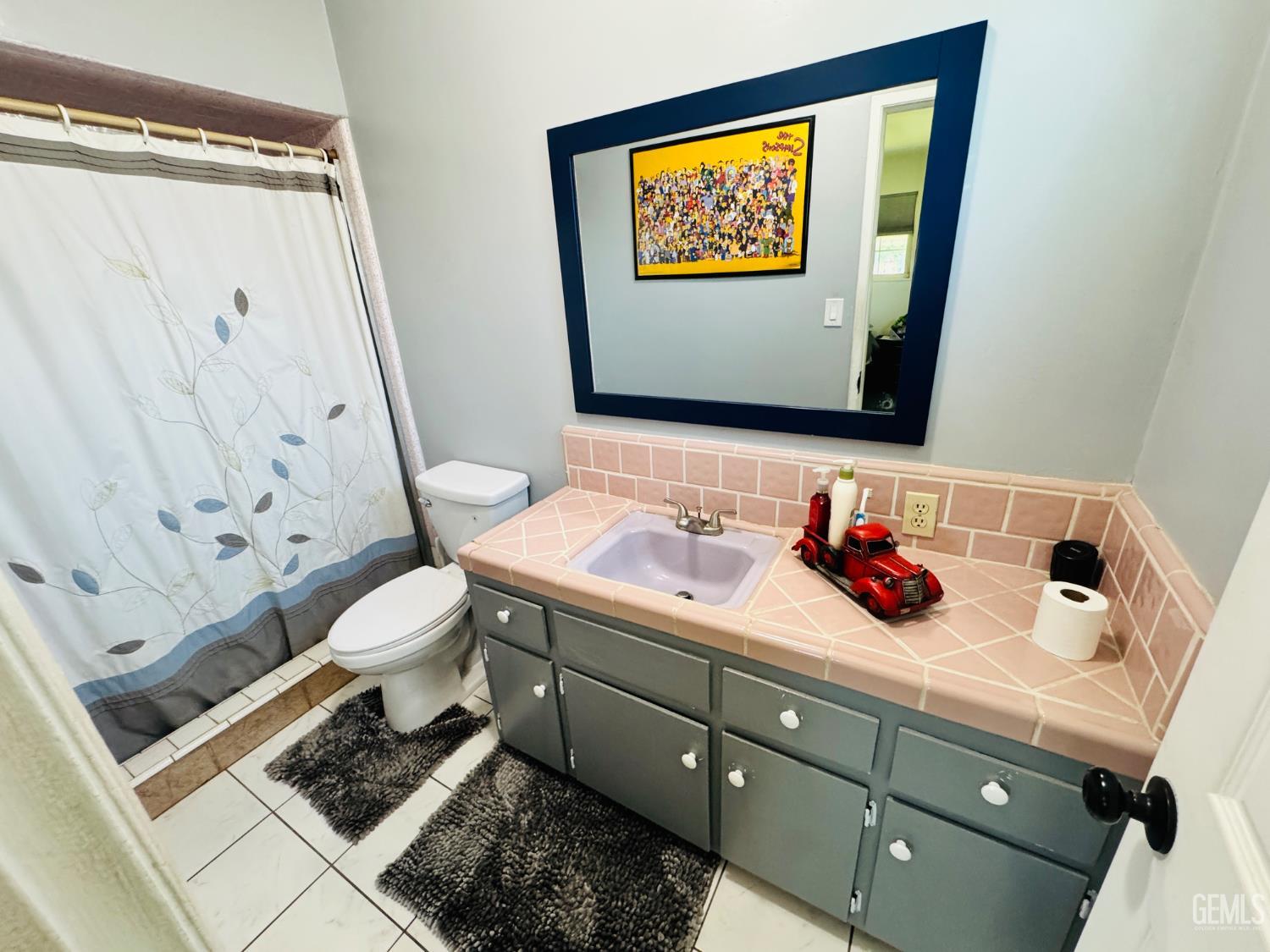 Undisclosed Address Delano, CA 93215 - Photo 8 of 14 a bathroom with a toilet sink and mirror