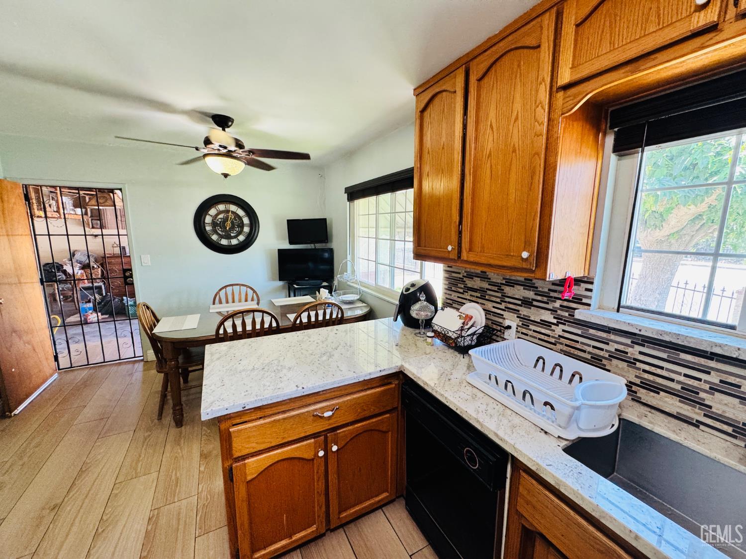 Undisclosed Address Delano, CA 93215 - Photo 9 of 14 a kitchen with a stove a sink and a refrigerator