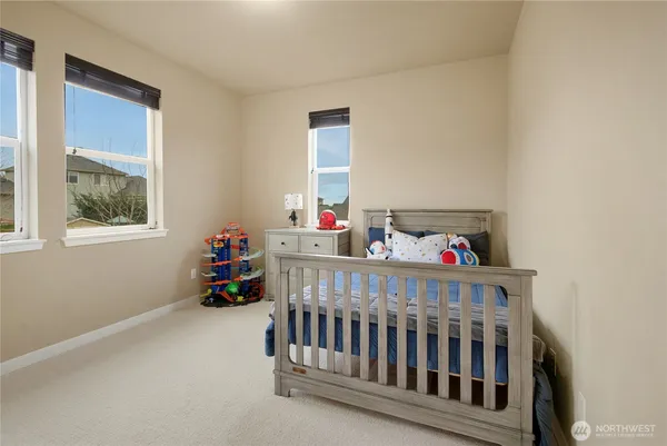 a bedroom with furniture and a window