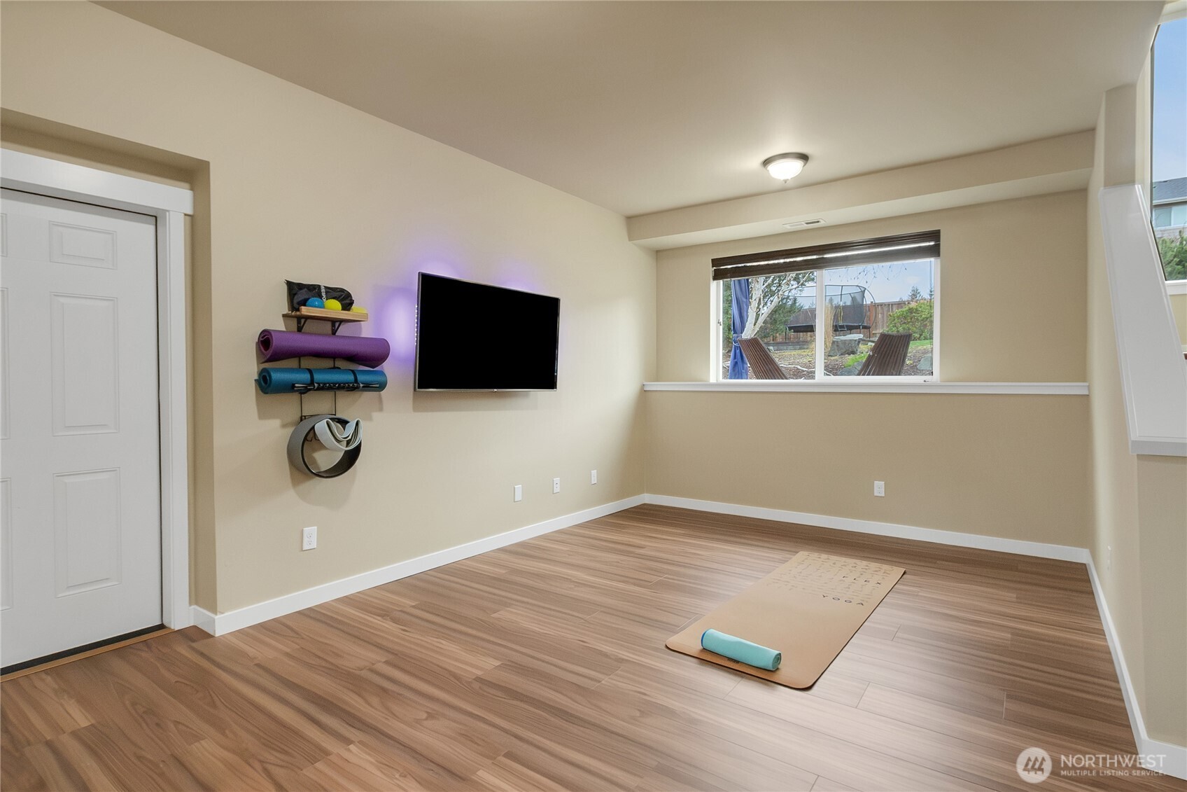 889 Lund Street Buckley, WA 98321 - Photo 17 of 27 a view of empty room with wooden floor and fan