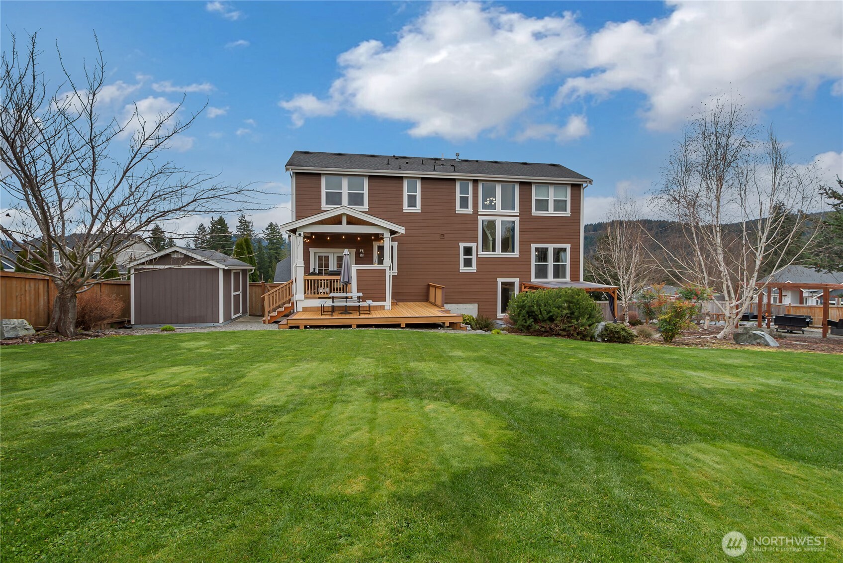889 Lund Street Buckley, WA 98321 - Photo 20 of 27 a front view of a house with a garden