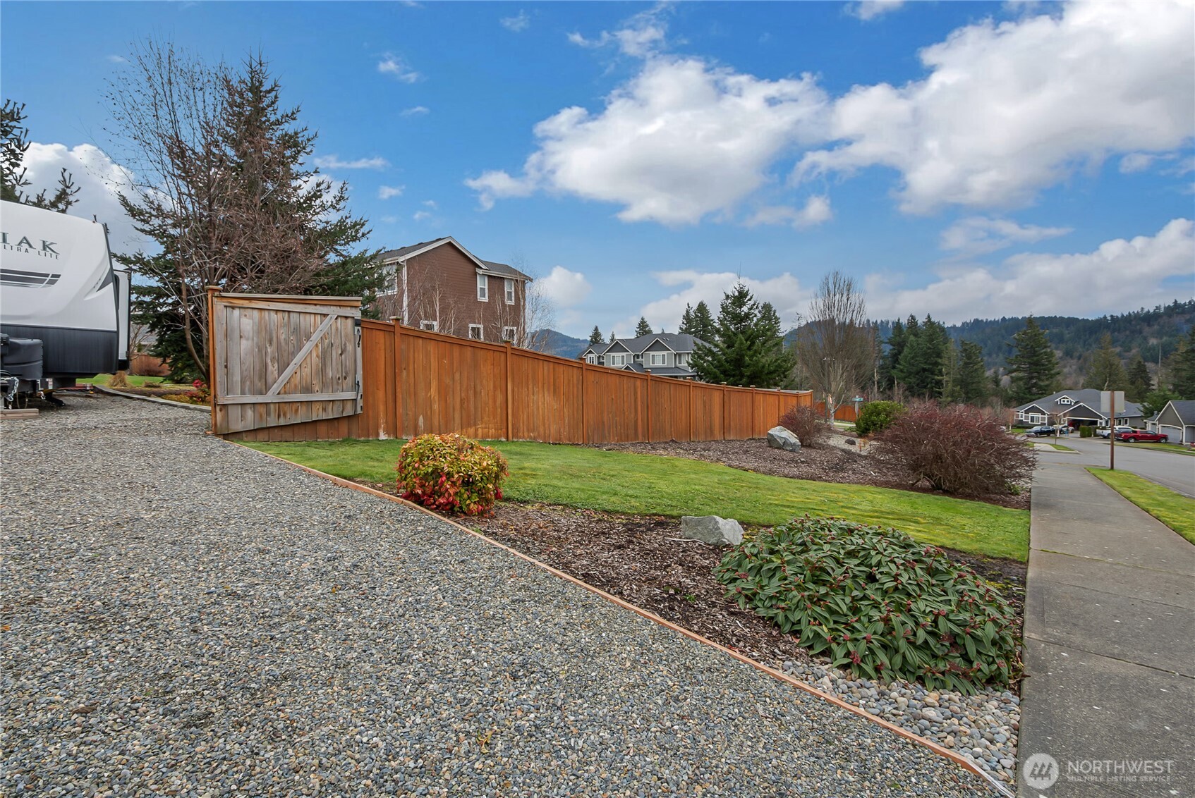 889 Lund Street Buckley, WA 98321 - Photo 26 of 27 a view of a backyard with plants and a garden