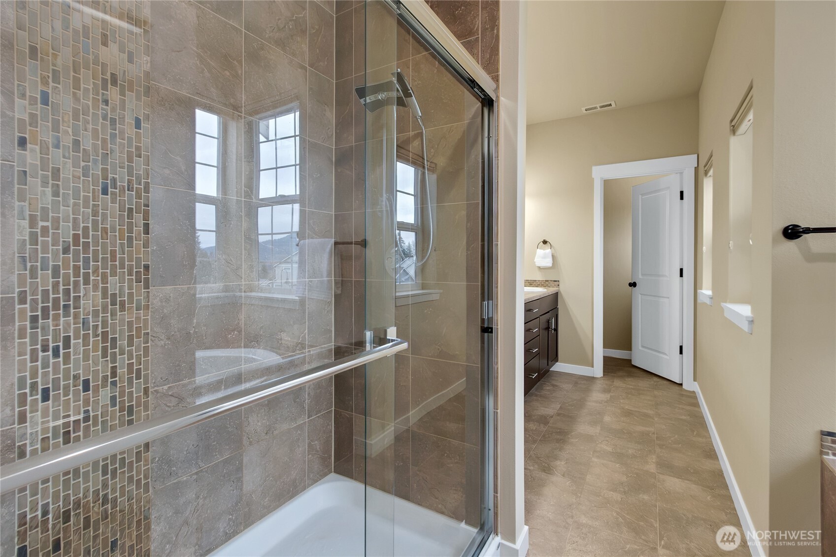 889 Lund Street Buckley, WA 98321 - Photo 10 of 27 a bathroom with a glass shower door