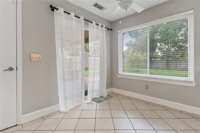 a kitchen with granite countertop a stove a sink dishwasher and a refrigerator