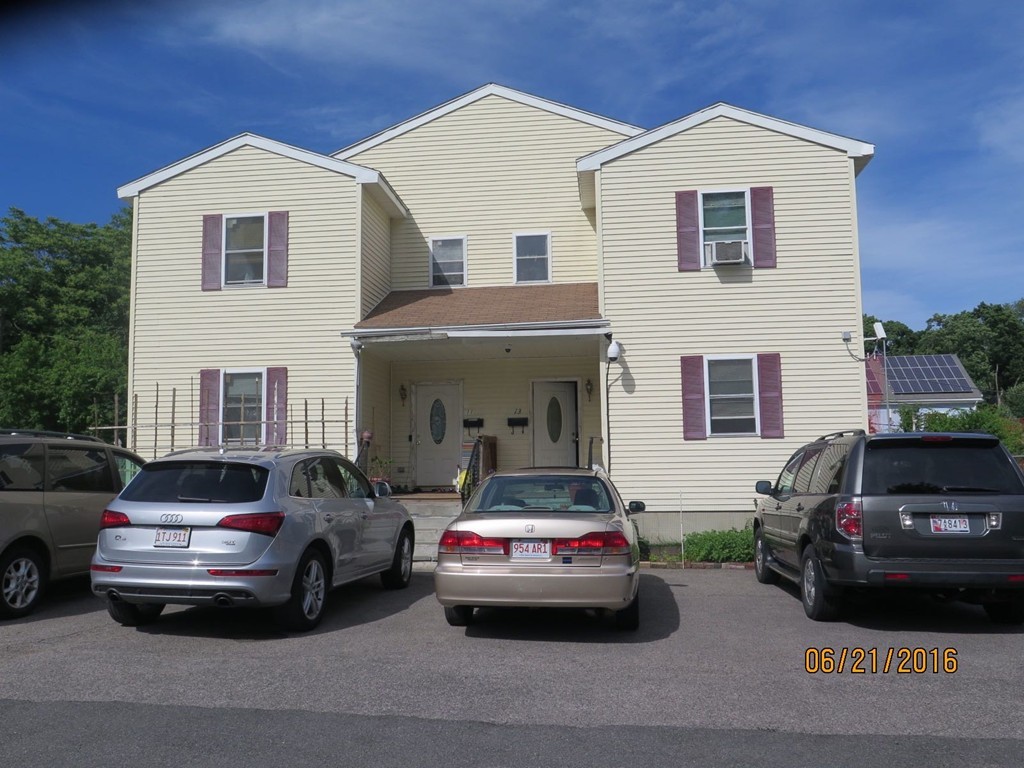 a car parked in front of a house