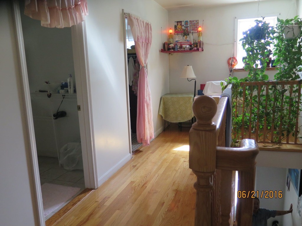 11-13 Gardner Street Worcester, MA 01610 - Photo 18 of 20 a view of a dining room with furniture wooden floor and a potted plant