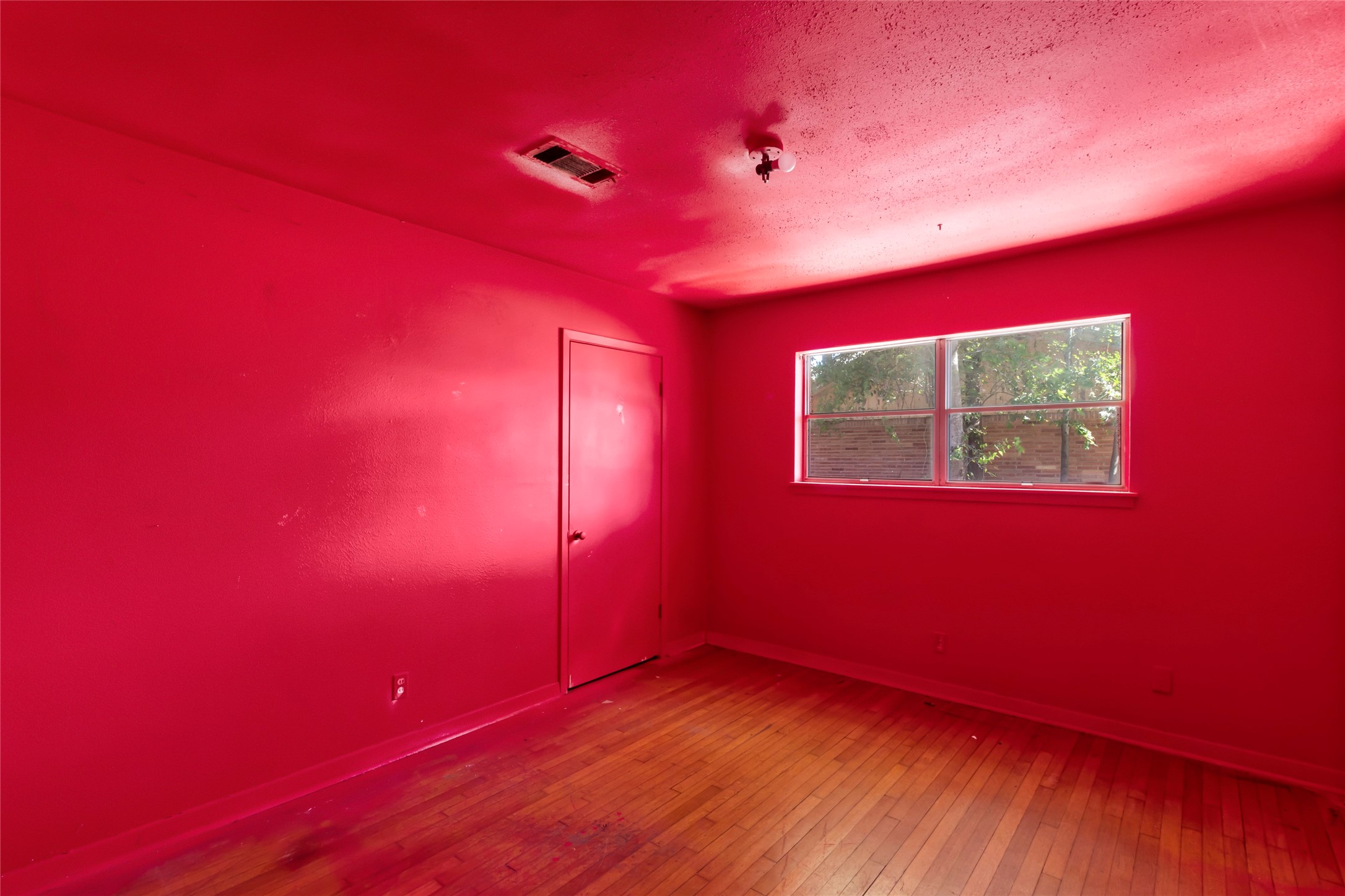 1427 West 22nd Street Houston, TX 77008 - Photo 12 of 23 a view of empty room with wooden floor and fan