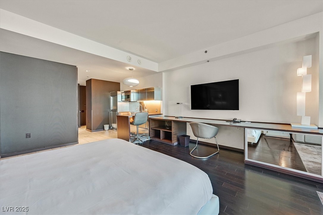 4381 West Flamingo Road, Unit 1609 Las Vegas, NV 89103 - Photo 12 of 27 Bedroom featuring light wood-style flooring