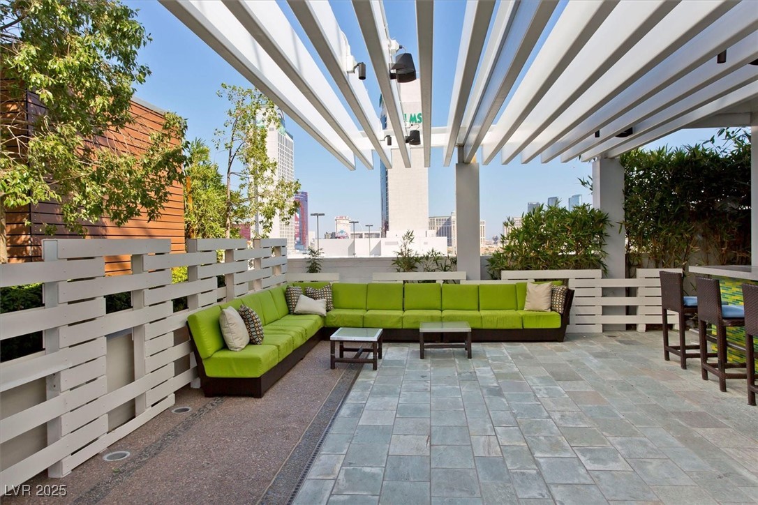 4381 West Flamingo Road, Unit 1609 Las Vegas, NV 89103 - Photo 22 of 27 View of patio featuring an outdoor living space and a pergola