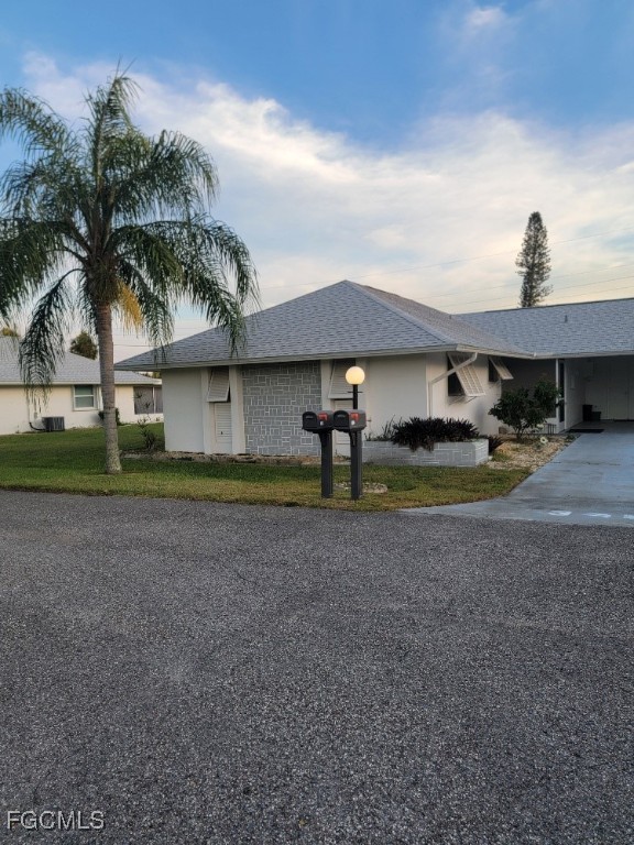 341 Richland Road Lehigh Acres, FL 33936 - Photo 1 of 16 a view of a house with backyard and tree