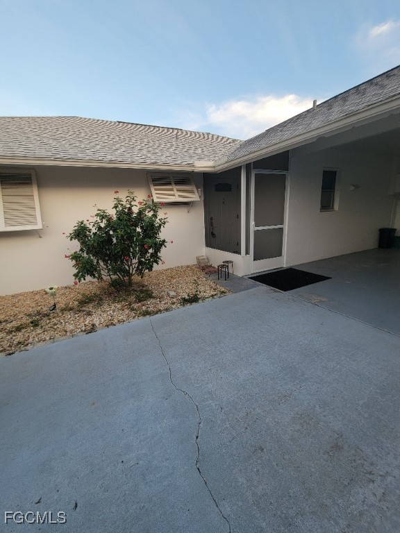 341 Richland Road Lehigh Acres, FL 33936 - Photo 4 of 16 a view of a house with potted plants