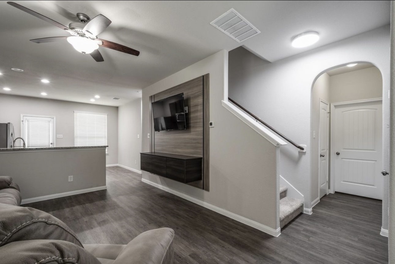 17542 Holroyd Road Humble, TX 77346 - Photo 3 of 16 a living room with furniture and a ceiling fan