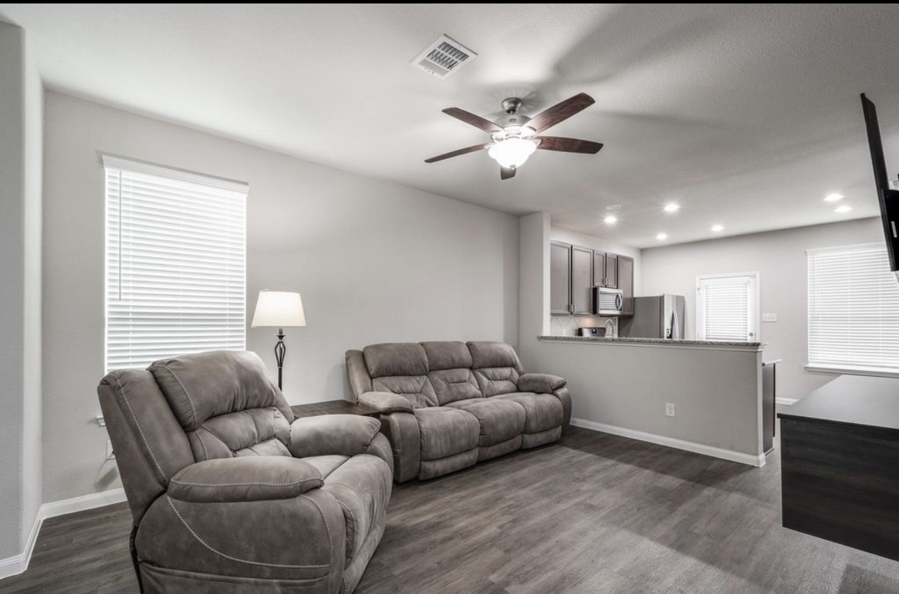 17542 Holroyd Road Humble, TX 77346 - Photo 4 of 16 a living room with furniture and a large window