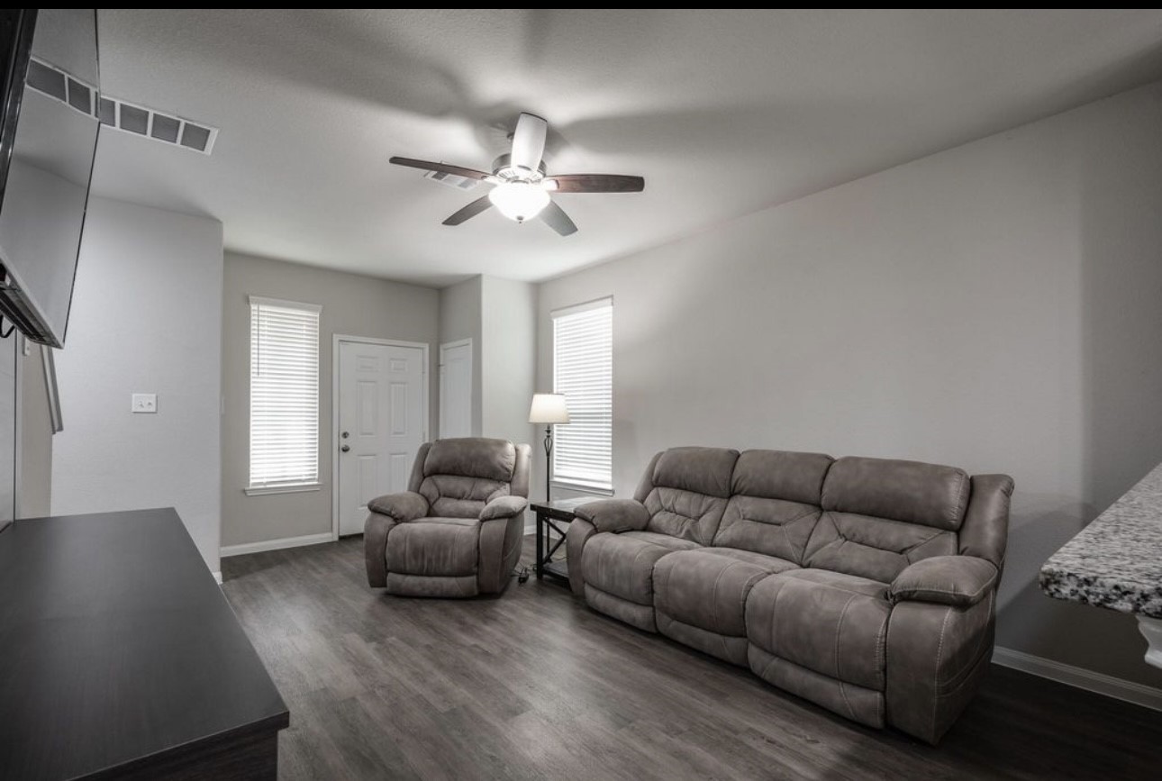 17542 Holroyd Road Humble, TX 77346 - Photo 5 of 16 a living room with furniture and a large window
