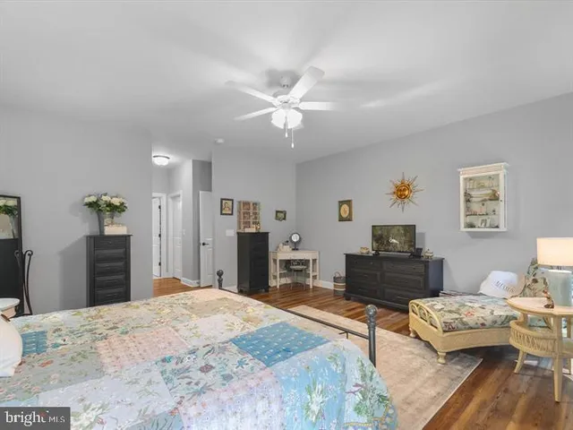 a bedroom with a bed and dresser