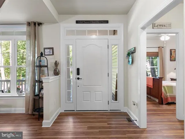 a view of entryway with wooden floor