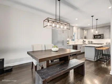 a kitchen with a table and chairs in it