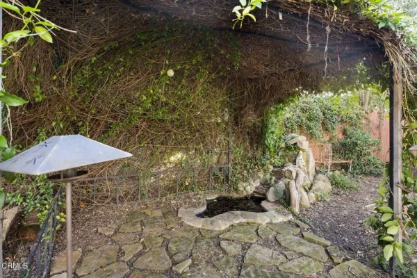 a view of a chair and table in the patio