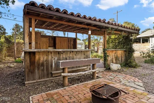 a view of a porch with furniture and wooden floor