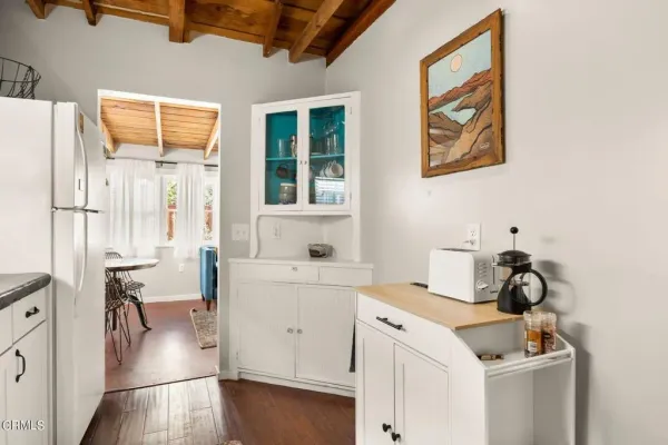 a view of a house with a yard and sitting area