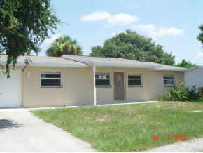 2430 Lisa Melbourne, FL 32935 - Photo 6 of 11 a front view of house with yard and green space