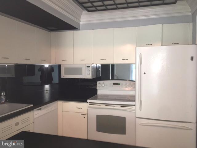 560 N Street Southwest, Unit N107 Washington, DC 20024 - Photo 6 of 10 a utility room with dryer and washer