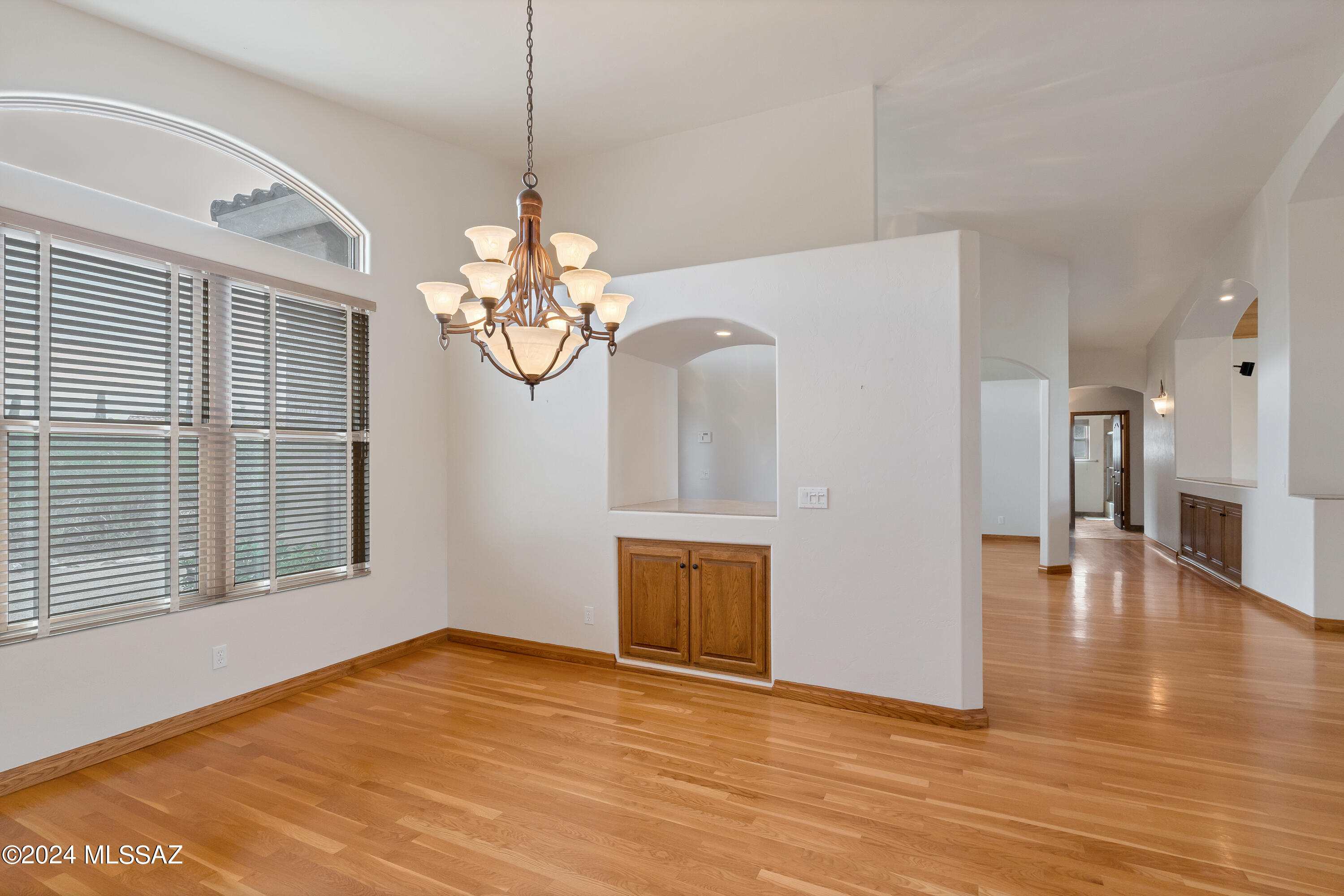 4001 North Harrison Road Tucson, AZ 85749 - Photo 24 of 50 a view of an empty room with wooden floor and a window