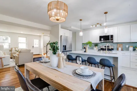 a bathroom with a sink toilet and mirror