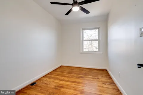 a picture of a bench in front of a window