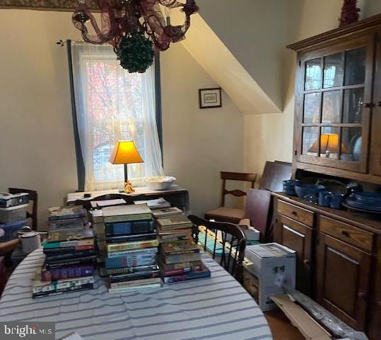 1807 Sutton Avenue Baltimore, MD 21227 - Photo 13 of 26 a room with furniture and wooden floor