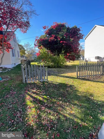 a room with furniture and wooden floor