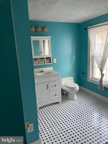 a kitchen with a stove and a refrigerator