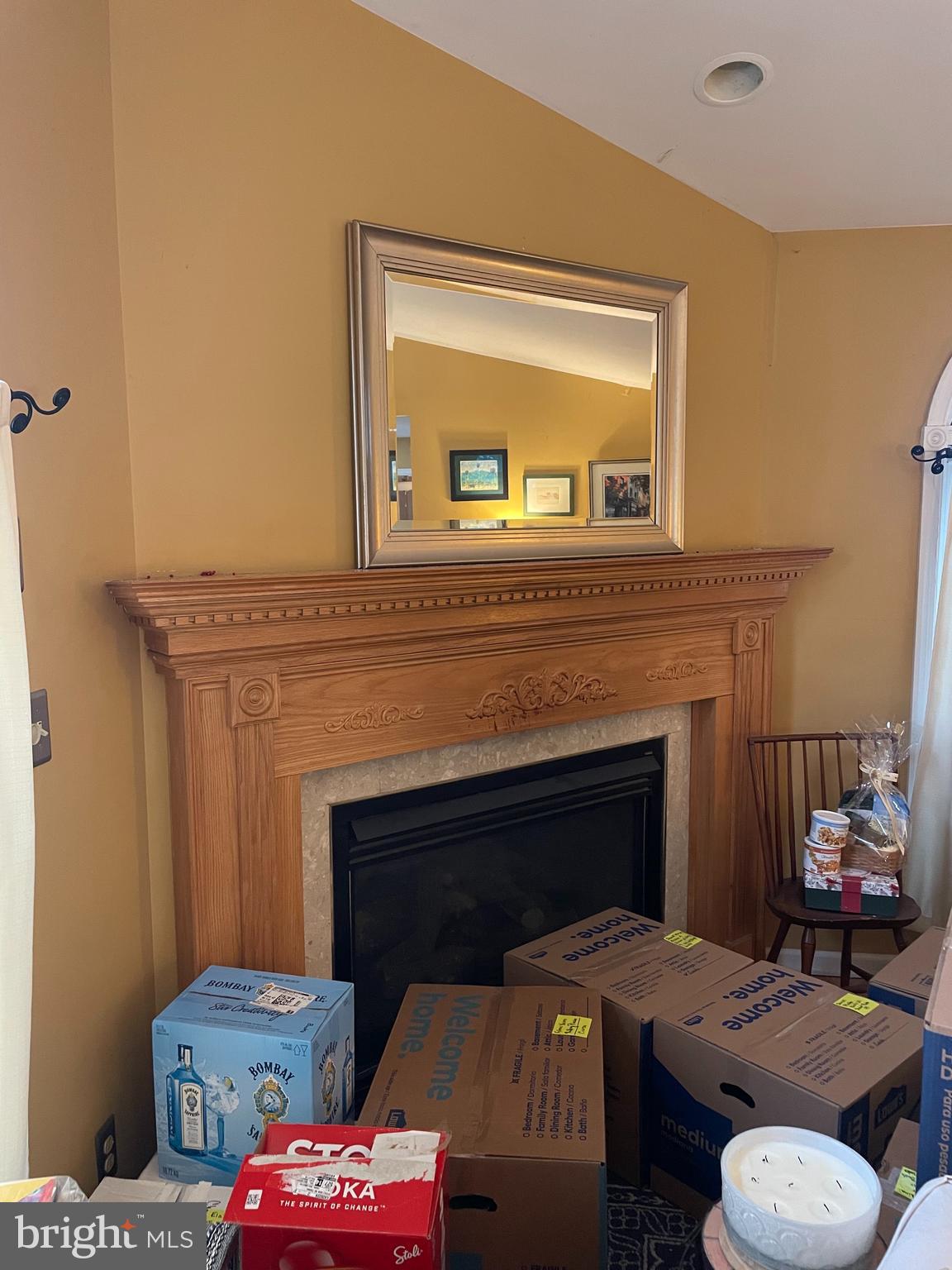 1807 Sutton Avenue Baltimore, MD 21227 - Photo 21 of 26 a living room with furniture and a fireplace