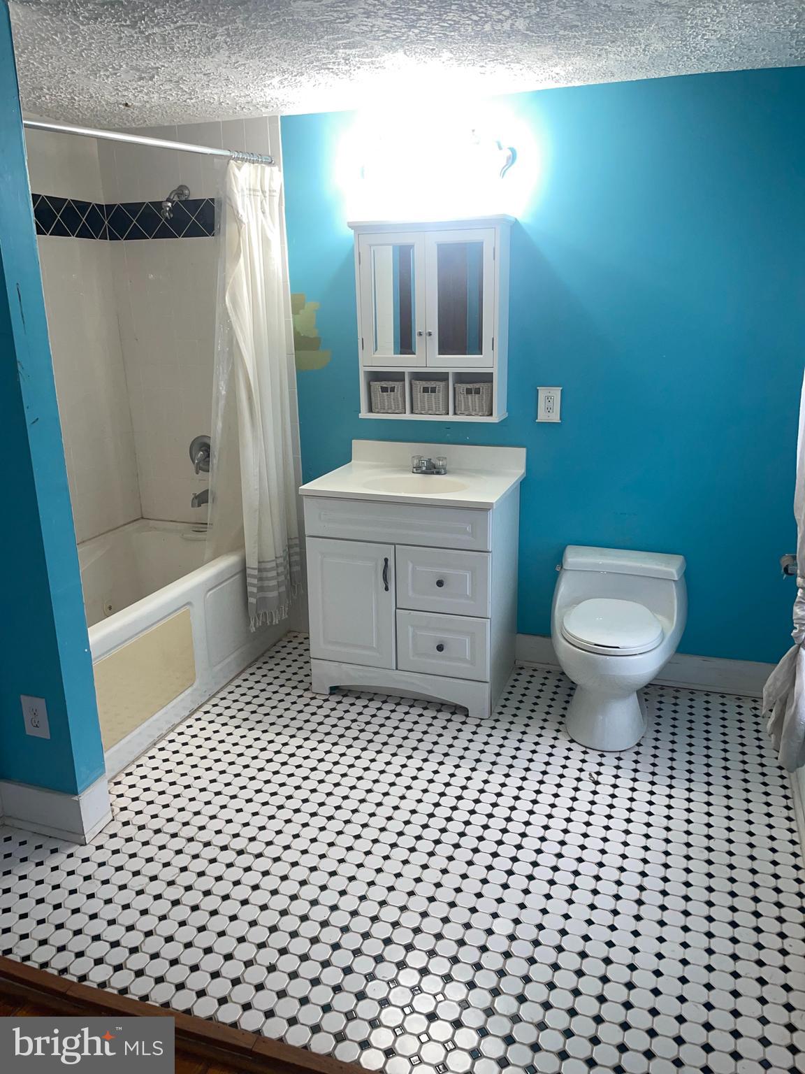 1807 Sutton Avenue Baltimore, MD 21227 - Photo 26 of 26 a bathroom with a sink a toilet and shower