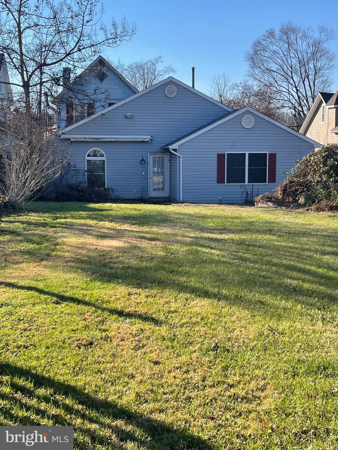 1807 Sutton Avenue Baltimore, MD 21227 - Photo 8 of 26 a front view of a house with a garden
