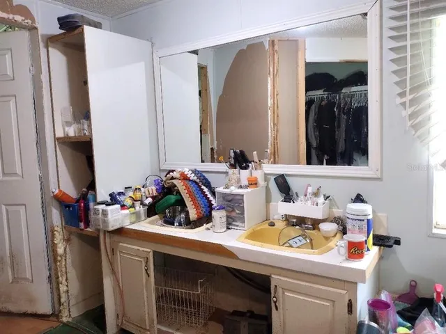 a bathroom with a sink and a mirror