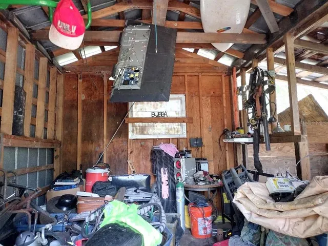 a view of a chairs and table in a room