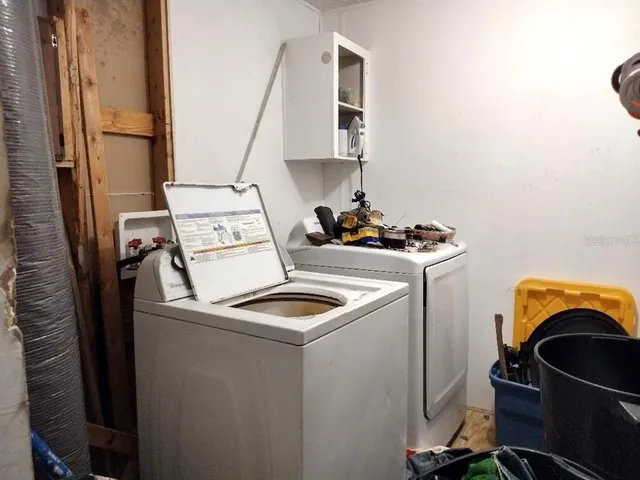 a utility room with dryer and washer