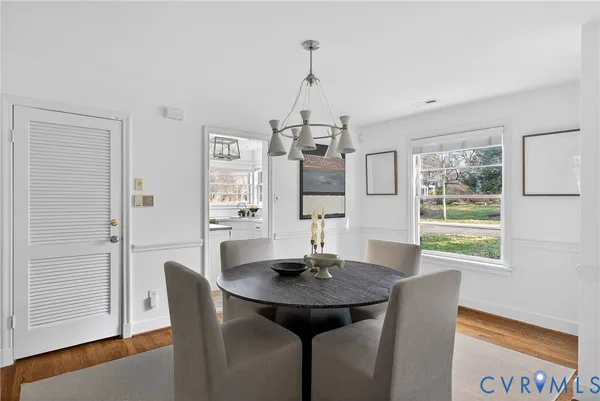 a view of a dining room with furniture window and wooden floor