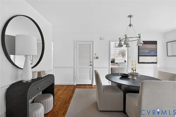 a living room with furniture and a mirror