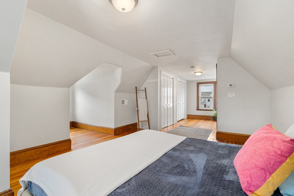9 Baker Road Everett, MA 02149 - Photo 11 of 14 a bedroom with a bed and a couch
